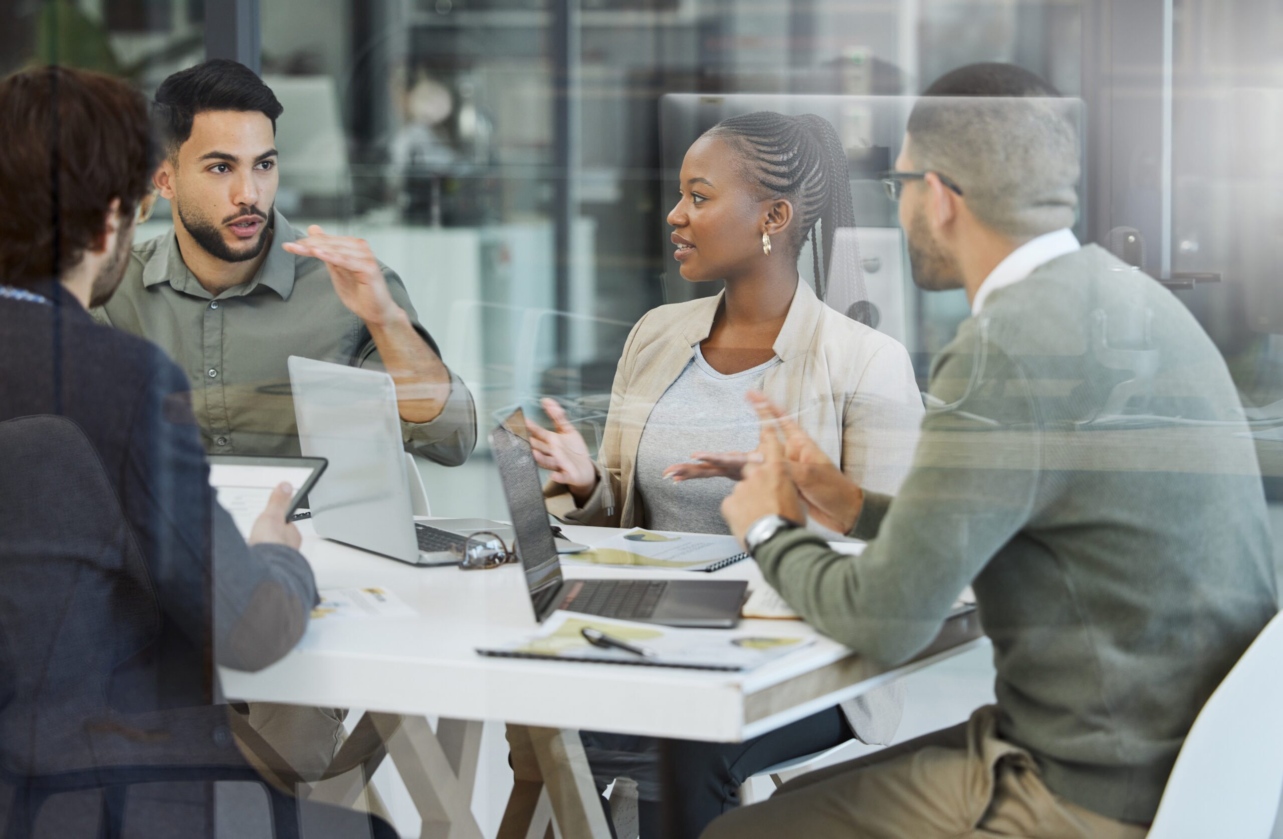 Shot of a group of businesspeople having a meeting in an office at work